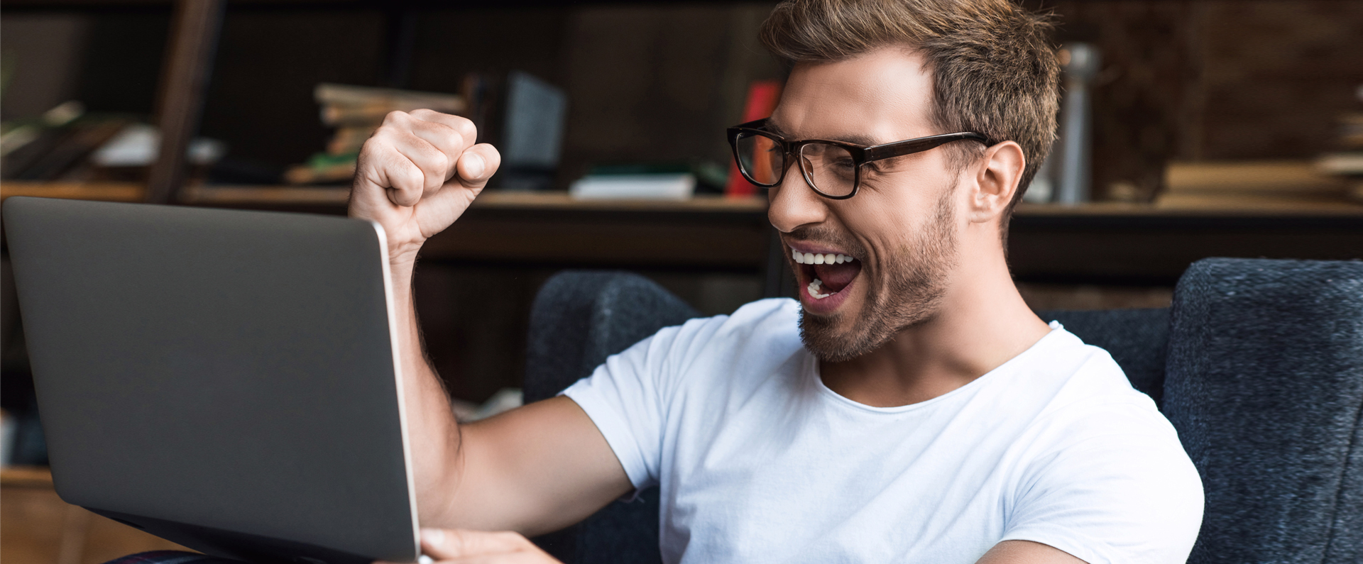 Cheering-Man-with-Laptop